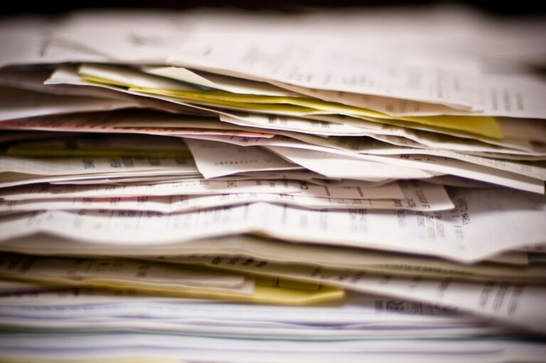 Thick stack of invoices, receipts and paperwork
